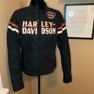 Like New, Women’s Harley Davidson, size small, black and orange riding jacket.